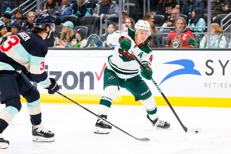 Feb 24, 2024; Seattle, Washington, USA; Minnesota Wild left wing Kirill Kaprizov (97) scores a goal against the Seattle Kraken during the second period at Climate Pledge Arena. Mandatory Credit: Joe Nicholson-USA TODAY Sports