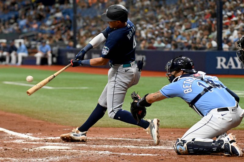 Sep 10, 2023; St. Petersburg, Florida, USA; Seattle Mariners second baseman Josh Rojas (4) hits a RBI single in the fourth inning against the Tampa Bay Rays at Tropicana Field. Mandatory Credit: Jonathan Dyer-USA TODAY Sports