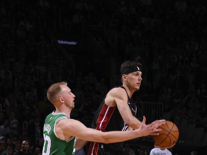 BOSTON, MA - APRIL 24: Sam Hauser #30 of the Boston Celtics plays defense during the game  against Tyler Herro #14 of the Miami Heat during Round 1 Game 2 of the 2024 NBA Playoffs on April 24, 2024 at the TD Garden in Boston, Massachusetts. NOTE TO USER: User expressly acknowledges and agrees that, by downloading and or using this photograph, User is consenting to the terms and conditions of the Getty Images License Agreement. Mandatory Copyright Notice: Copyright 2024 NBAE  (Photo by Brian Babineau/NBAE via Getty Images)