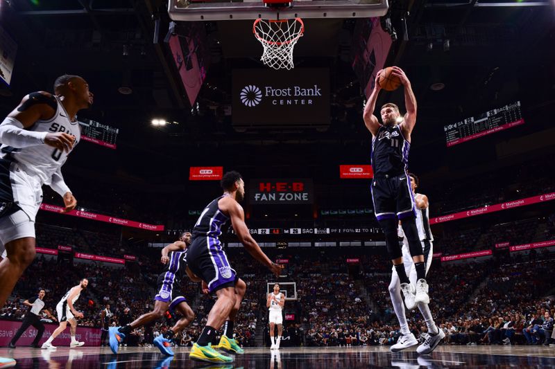 SAN ANTONIO, TX - NOVEMBER 11: Domantas Sabonis #11 of the Sacramento Kings goes up for the rebound during the game  against the San Antonio Spurson November 11, 2024 at the Frost Bank Center in San Antonio, Texas. NOTE TO USER: User expressly acknowledges and agrees that, by downloading and or using this photograph, user is consenting to the terms and conditions of the Getty Images License Agreement. Mandatory Copyright Notice: Copyright 2024 NBAE (Photos by Garrett Ellwood/NBAE via Getty Images)