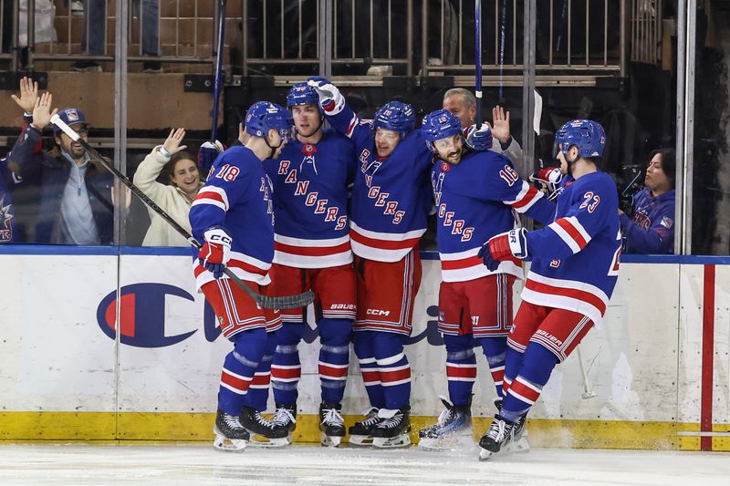 Mar 18, 2025; New York, New York, USA;  New York Rangers left wing Artemi Panarin (10) celebrates with his teammates after scoring a goal in the first period against the Calgary Flames at Madison Square Garden. Mandatory Credit: Wendell Cruz-Imagn Images