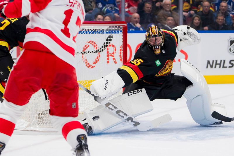 Feb 15, 2024; Vancouver, British Columbia, CAN; Vancouver Canucks goalie Thatcher Demko (35) makes a save on Detroit Red Wings forward Daniel Sprong (17)  in the second period at Rogers Arena. Mandatory Credit: Bob Frid-USA TODAY Sports