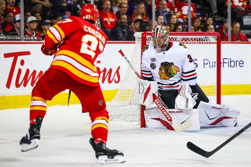 Nov 7, 2025; Calgary, Alberta, CAN; Chicago Blackhawks goaltender Spencer Knight (30) makes a save against Calgary Flames right wing Matt Coronato (27) during the second period at Scotiabank Saddledome. Mandatory Credit: Sergei Belski-Imagn Images