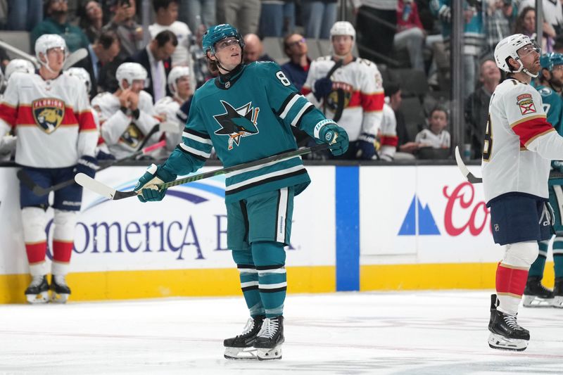 Nov 8, 2025; San Jose, California, USA; San Jose Sharks right wing Adam Gaudette (center) watches a replay of his goal on the main screen during the second period against the Florida Panthers at SAP Center at San Jose. Mandatory Credit: Darren Yamashita-Imagn Images