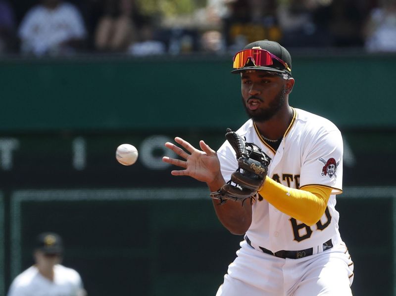 Aug 13, 2023; Pittsburgh, Pennsylvania, USA; Pittsburgh Pirates shortstop Liover Peguero (60) takes a throw to begin a double play against the Cincinnati Reds during the third inning at PNC Park. Mandatory Credit: Charles LeClaire-USA TODAY Sports