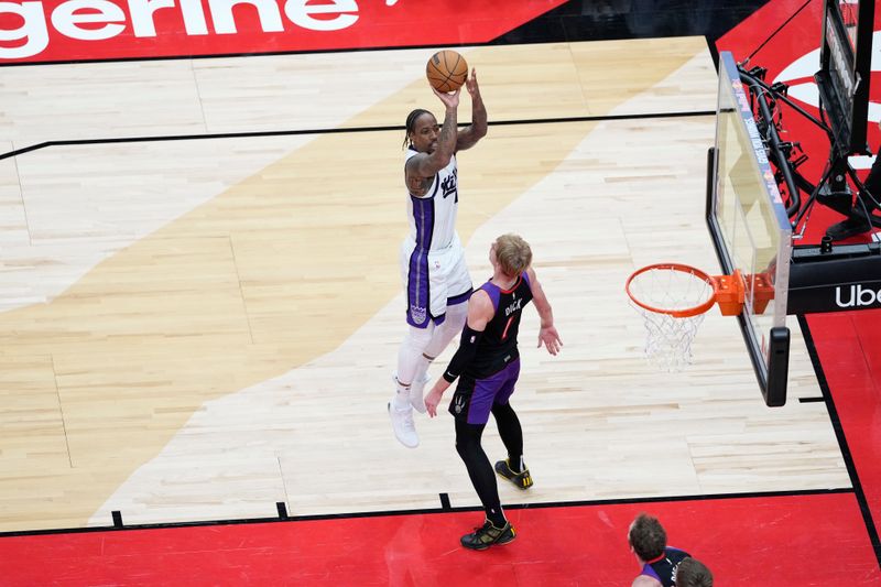 TORONTO, CANADA - NOVEMBER 2: DeMar DeRozan #10 of the Sacramento Kings shoots the ball during the game against the Toronto Raptors on November 2, 2024 at the Scotiabank Arena in Toronto, Ontario, Canada.  NOTE TO USER: User expressly acknowledges and agrees that, by downloading and or using this Photograph, user is consenting to the terms and conditions of the Getty Images License Agreement.  Mandatory Copyright Notice: Copyright 2024 NBAE (Photo by Andrew Lahodynskyj/NBAE via Getty Images)