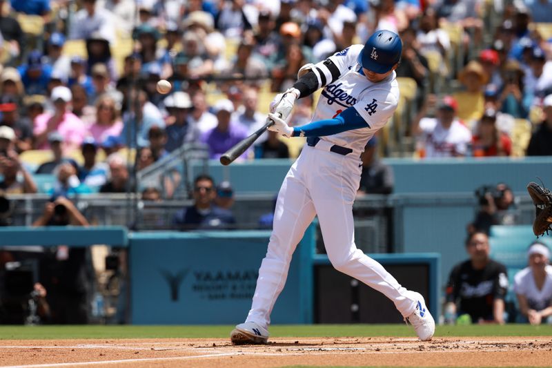 May 5, 2024; Los Angeles, California, USA;  Los Angeles Dodgers designated hitter Shohei Ohtani (17) hits a home run during the first inning against the Atlanta Braves at Dodger Stadium. Mandatory Credit: Kiyoshi Mio-USA TODAY Sports