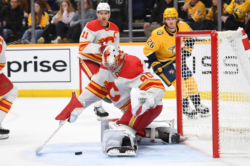 Jan 4, 2024; Nashville, Tennessee, USA; Calgary Flames goaltender Dan Vladar (80) makes a save during the third period against the Nashville Predators at Bridgestone Arena. Mandatory Credit: Christopher Hanewinckel-USA TODAY Sports