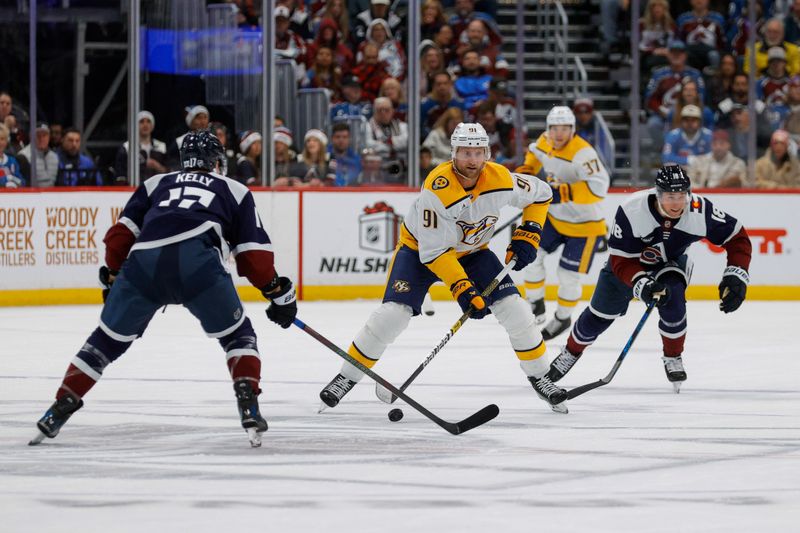 Dec 13, 2025; Denver, Colorado, USA; Nashville Predators center Steven Stamkos (91) controls the puck against Colorado Avalanche center Parker Kelly (17) and center Jack Drury (18) in the third period at Ball Arena. Mandatory Credit: Isaiah J. Downing-Imagn Images