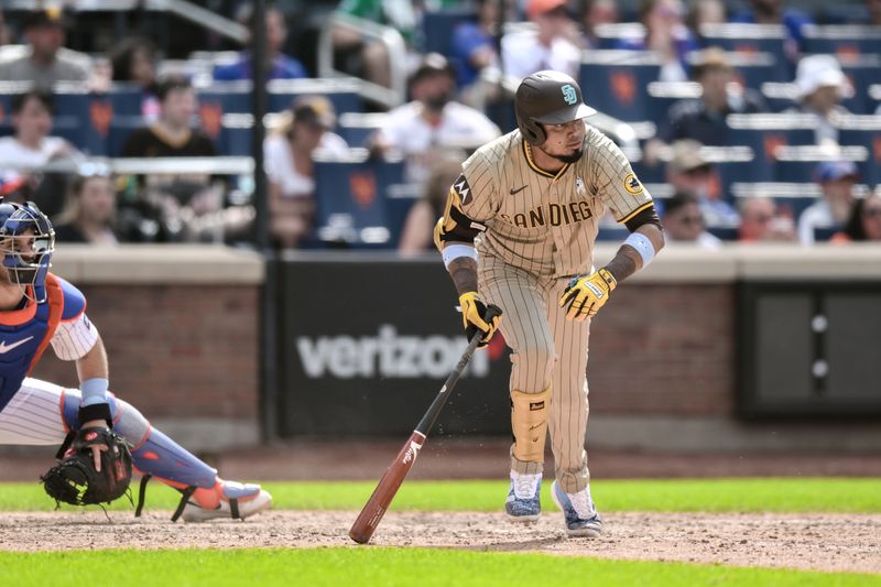 Jun 16, 2024; New York City, New York, USA; San Diego Padres second baseman Luis Arraez (4) hits a single against the New York Mets during the eighth inning at Citi Field. Mandatory Credit: John Jones-USA TODAY Sports