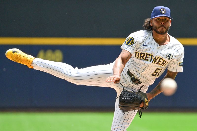 Jun 2, 2024; Milwaukee, Wisconsin, USA; Milwaukee Brewers starting pitcher Freddy Peralta (51) pitches against the Chicago White Sox in the first inning at American Family Field. Mandatory Credit: Benny Sieu-USA TODAY Sports