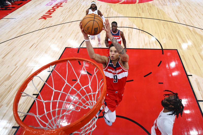 TORONTO, CANADA - OCTOBER 20: Ryan Rollins #9 of the Washington Wizards dunks the ball during the game against the Toronto Raptors on October 20, 2023 at the Scotiabank Arena in Toronto, Ontario, Canada.  NOTE TO USER: User expressly acknowledges and agrees that, by downloading and or using this Photograph, user is consenting to the terms and conditions of the Getty Images License Agreement.  Mandatory Copyright Notice: Copyright 2023 NBAE (Photo by Vaughn Ridley/NBAE via Getty Images)