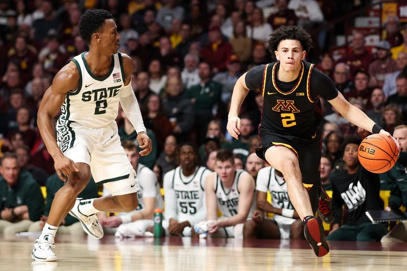 Feb 6, 2024; Minneapolis, Minnesota, USA; Minnesota Golden Gophers guard Mike Mitchell Jr. (2) works around Michigan State Spartans guard Tyson Walker (2) during the first half at Williams Arena. Mandatory Credit: Matt Krohn-USA TODAY Sports