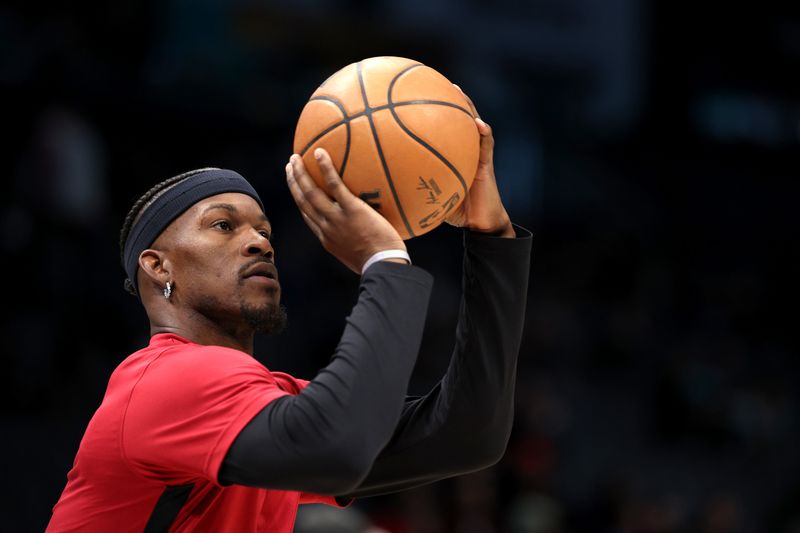 CHARLOTTE, NORTH CAROLINA - DECEMBER 11: Jimmy Butler #22 of the Miami Heat warms up prior to their game against the Charlotte Hornets at Spectrum Center on December 11, 2023 in Charlotte, North Carolina. NOTE TO USER: User expressly acknowledges and agrees that, by downloading and or using this photograph, User is consenting to the terms and conditions of the Getty Images License Agreement. (Photo by Jared C. Tilton/Getty Images)