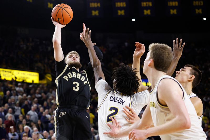 Feb 11, 2025; Ann Arbor, Michigan, USA;  Purdue Boilermakers guard Braden Smith (3) shoots against Michigan Wolverines guard L.J. Cason (2) in the second half at Crisler Center. Mandatory Credit: Rick Osentoski-Imagn Images