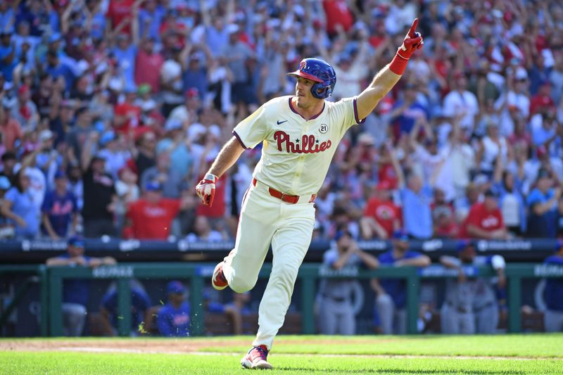 Sep 15, 2024; Philadelphia, Pennsylvania, Philadelphia Phillies catcher J.T. Realmuto (10) hits a walk-off RBI single during the ninth inning against the New York Mets USA; at Citizens Bank Park. Mandatory Credit: Eric Hartline-Imagn Images