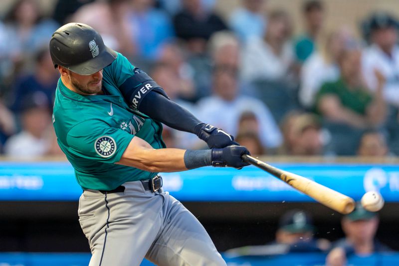 May 8, 2024; Minneapolis, Minnesota, USA; Seattle Mariners designated hitter Mitch Garver (18) hits a single against the Minnesota Twins in the sixth inning at Target Field. Mandatory Credit: Jesse Johnson-USA TODAY Sports