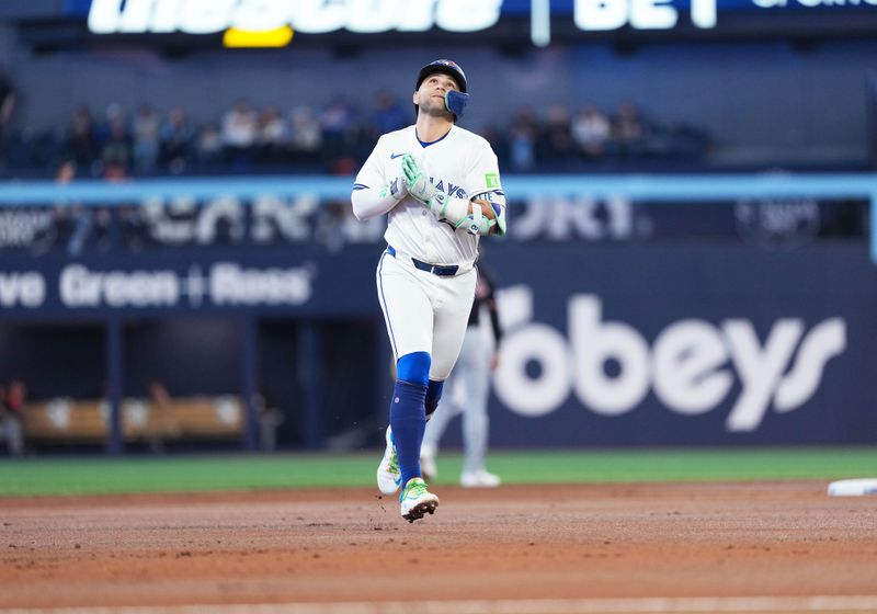 May 3, 2025; Toronto, Ontario, CAN; Toronto Blue Jays shortstop Bo Bichette (11) celebrates  after hitting a home run during the first inning at Rogers Centre. Mandatory Credit: Nick Turchiaro-Imagn Images
