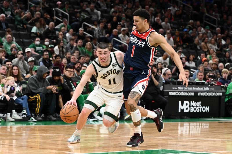 BOSTON, MASSACHUSETTS - APRIL 14: Payton Pritchard #11 of the Boston Celtics drives to the basket against Johnny Davis #1 of the Washington Wizards  during the fourth quarter at the TD Garden on April 14, 2024 in Boston, Massachusetts. NOTE TO USER: User expressly acknowledges and agrees that, by downloading and or using this photograph, User is consenting to the terms and conditions of the Getty Images License Agreement. (Photo by Brian Fluharty/Getty Images)