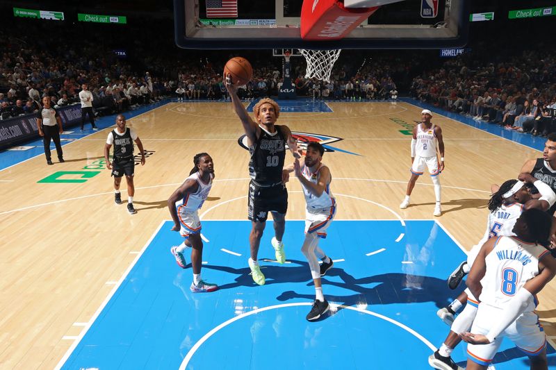 OKLAHOMA CITY, OK - OCTOBER 30: Jeremy Sochan #10 of the San Antonio Spurs drives to the basket during the game against the Oklahoma City Thunder on October 30, 2024 at Paycom Arena in Oklahoma City, Oklahoma. NOTE TO USER: User expressly acknowledges and agrees that, by downloading and or using this photograph, User is consenting to the terms and conditions of the Getty Images License Agreement. Mandatory Copyright Notice: Copyright 2024 NBAE (Photo by Zach Beeker/NBAE via Getty Images)