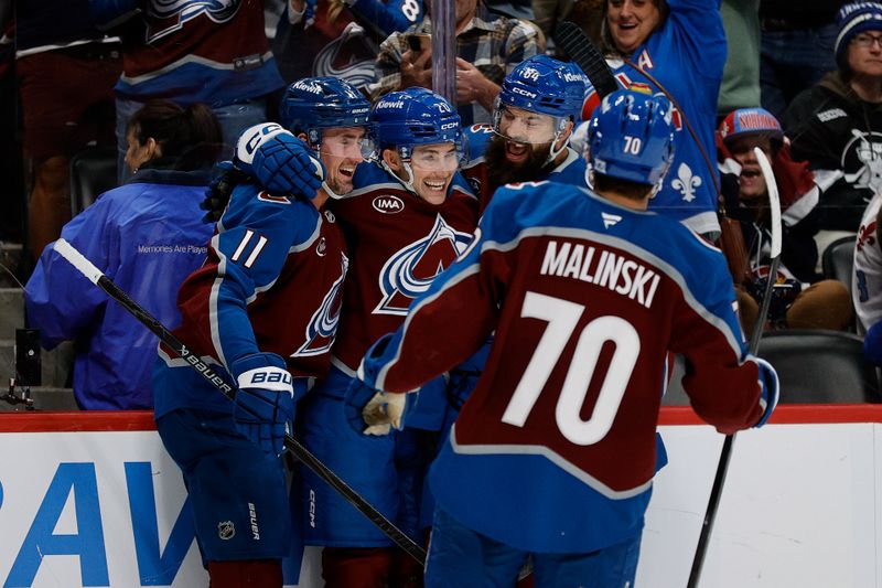 Nov 4, 2025; Denver, Colorado, USA; Colorado Avalanche center Ross Colton (20) celebrates his goal with center Brock Nelson (11) and defenseman Brent Burns (84) and defenseman Sam Malinski (70) in the second period against the Tampa Bay Lightning at Ball Arena. Mandatory Credit: Isaiah J. Downing-Imagn Images