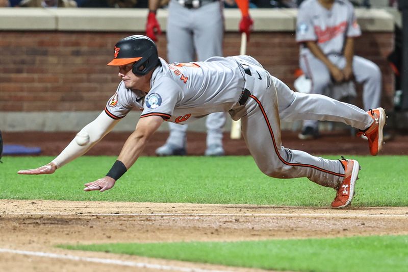 Aug 20, 2024; New York City, New York, USA;  Baltimore Orioles first baseman Ryan Mountcastle (6) slides into home plate in the ninth inning against the New York Mets at Citi Field. Mandatory Credit: Wendell Cruz-USA TODAY Sports