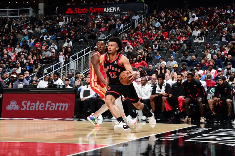 ATLANTA, GA - JANUARY 28: Jordan Nwora #13 of the Toronto Raptors drives to the basket during the game against the Atlanta Hawks on January 28, 2024 at State Farm Arena in Atlanta, Georgia.  NOTE TO USER: User expressly acknowledges and agrees that, by downloading and/or using this Photograph, user is consenting to the terms and conditions of the Getty Images License Agreement. Mandatory Copyright Notice: Copyright 2024 NBAE (Photo by Scott Cunningham/NBAE via Getty Images)