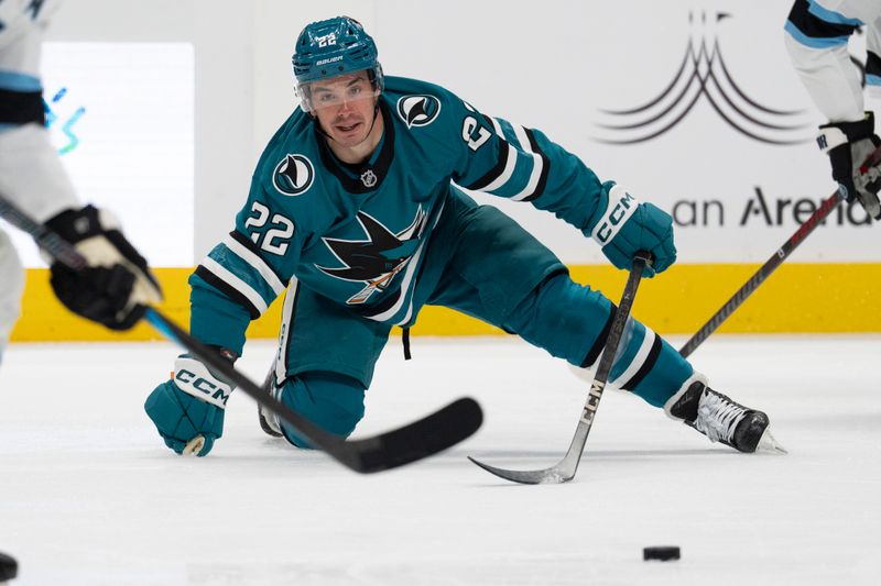 Oct 1, 2024; San Jose, California, USA;  San Jose Sharks center Andrew Poturalski (22) watches the puck after falling during the second period against the Utah Hockey Club at SAP Center at San Jose. Mandatory Credit: Stan Szeto-Imagn Images
