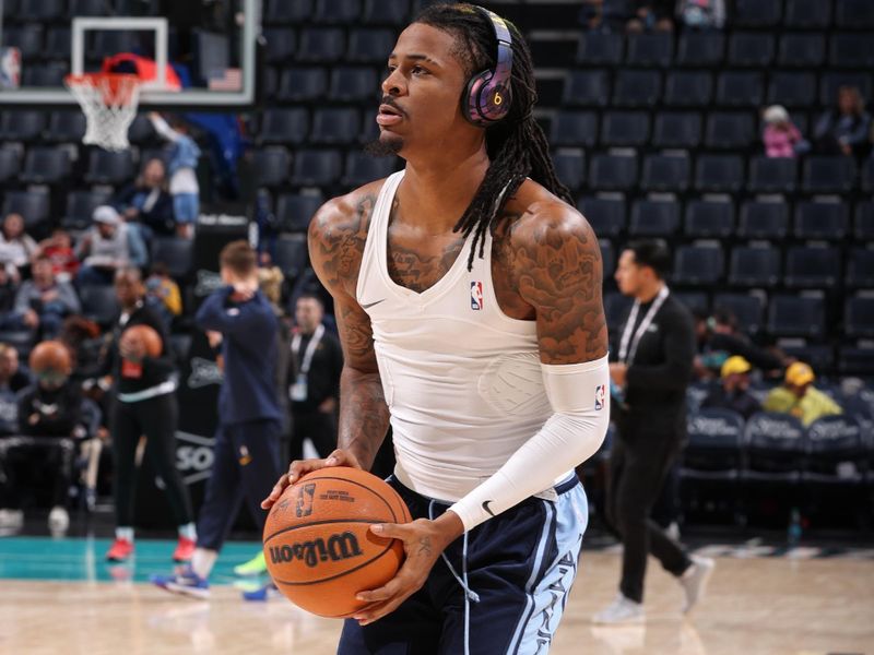 MEMPHIS, TN - DECEMBER 1: Ja Morant #12 of the Memphis Grizzlies warms up before the game against the Indiana Pacers on December 1, 2024 at FedExForum in Memphis, Tennessee. NOTE TO USER: User expressly acknowledges and agrees that, by downloading and or using this photograph, User is consenting to the terms and conditions of the Getty Images License Agreement. Mandatory Copyright Notice: Copyright 2024 NBAE (Photo by Joe Murphy/NBAE via Getty Images)