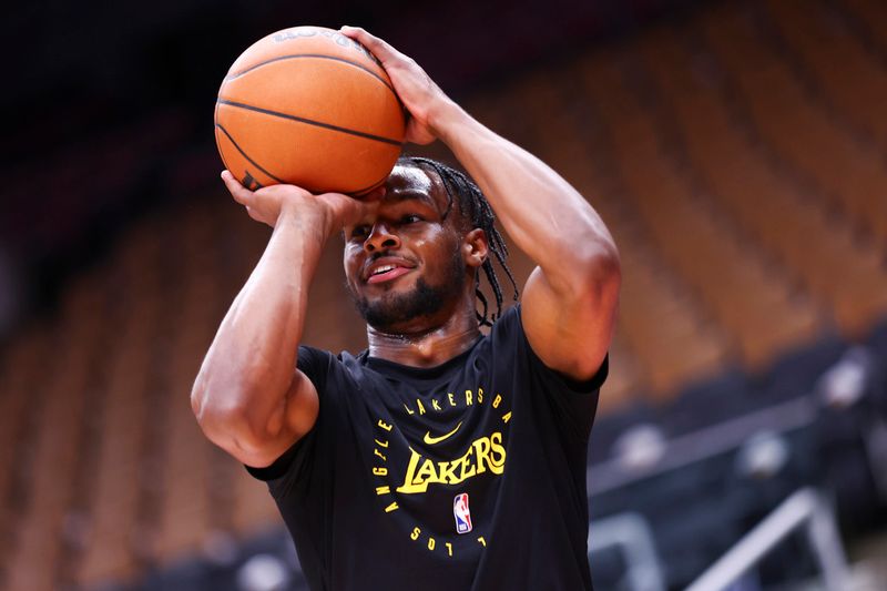 TORONTO, CANADA - NOVEMBER 1: Bronny James #9 of the Los Angeles Lakers warms up before the game against the Toronto Raptors on November 1, 2024 at the Scotiabank Arena in Toronto, Ontario, Canada.  NOTE TO USER: User expressly acknowledges and agrees that, by downloading and or using this Photograph, user is consenting to the terms and conditions of the Getty Images License Agreement.  Mandatory Copyright Notice: Copyright 2024 NBAE (Photo by Vaughn Ridley/NBAE via Getty Images)