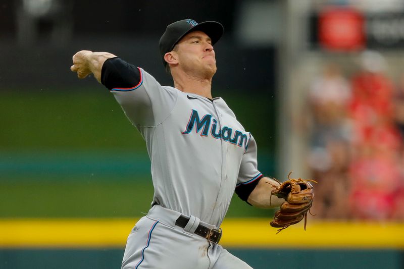 Aug 8, 2023; Cincinnati, Ohio, USA; Miami Marlins shortstop Joey Wendle (18) throws to first to get Cincinnati Reds third baseman Nick Senzel (not pictured) out in the fifth inning at Great American Ball Park. Mandatory Credit: Katie Stratman-USA TODAY Sports