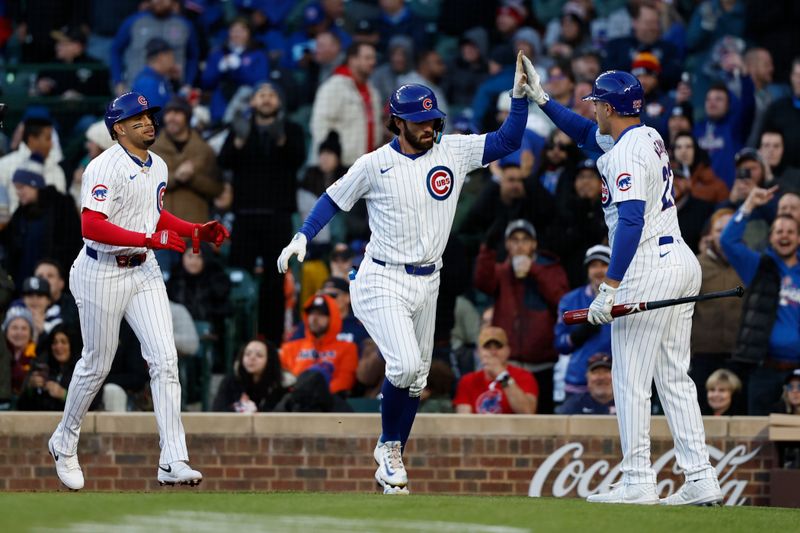Apr 24, 2024; Chicago, Illinois, USA; Chicago Cubs shortstop Dansby Swanson (7) celebrates with teammates after hitting a three-run home run against the Houston Astros during the first inning at Wrigley Field. Mandatory Credit: Kamil Krzaczynski-USA TODAY Sports