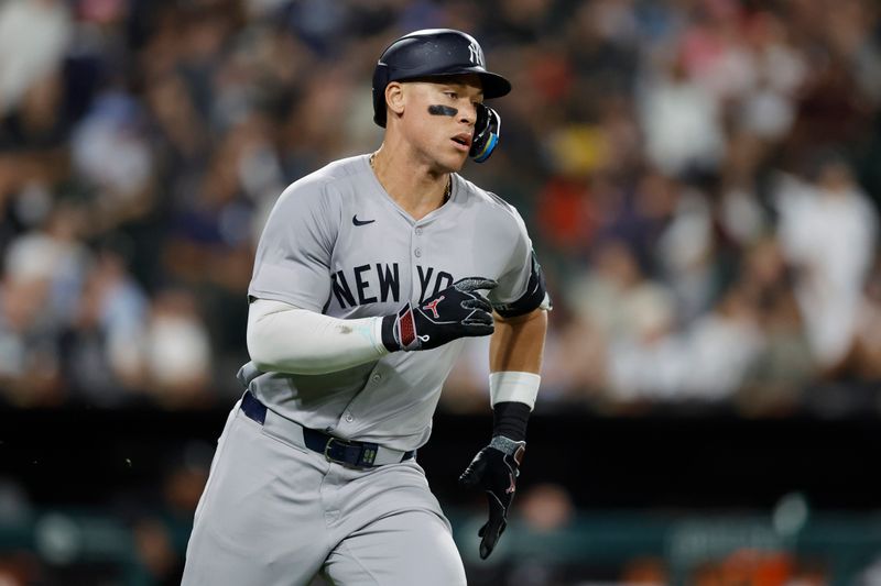 Aug 13, 2024; Chicago, Illinois, USA; New York Yankees outfielder Aaron Judge (99) runs after hitting a single against the Chicago White Sox during the seventh inning at Guaranteed Rate Field. Mandatory Credit: Kamil Krzaczynski-USA TODAY Sports
