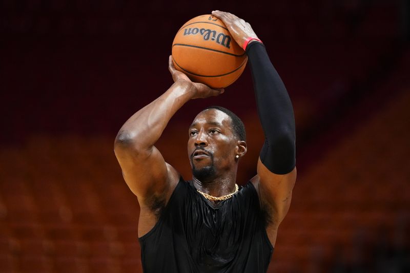 MIAMI, FLORIDA - JANUARY 08: Bam Adebayo #13 of the Miami Heat warms up prior to a game against the Houston Rockets at Kaseya Center on January 08, 2024 in Miami, Florida. NOTE TO USER: User expressly acknowledges and agrees that, by downloading and or using this photograph, User is consenting to the terms and conditions of the Getty Images License Agreement. (Photo by Rich Storry/Getty Images)