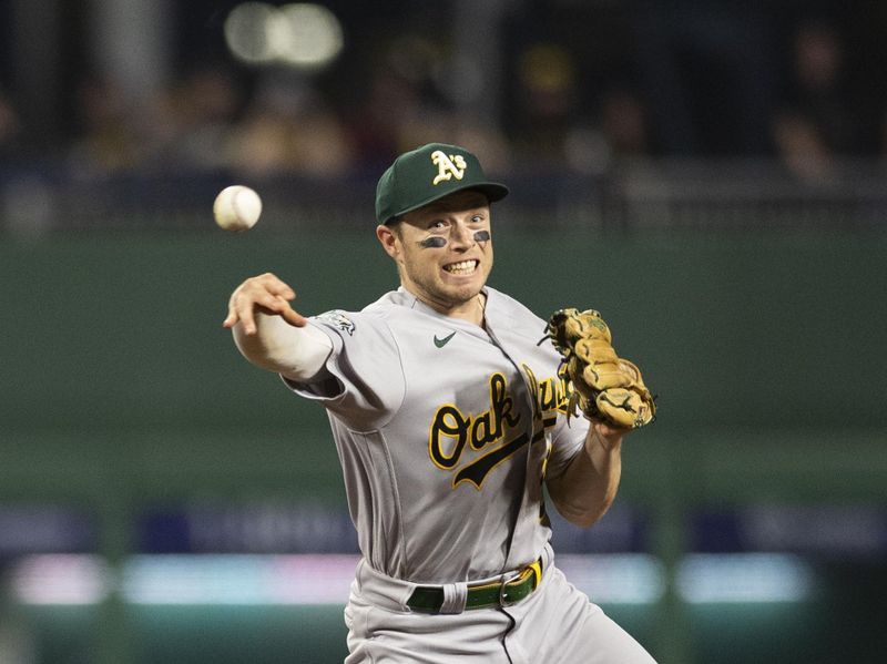 Jun 5, 2023; Pittsburgh, Pennsylvania, USA;  Oakland Athletics shortstop Nick Allen (2) throws the ball to first base to complete a double play against the Pittsburgh Pirates during the seventh inning at PNC Park. Mandatory Credit: Scott Galvin-USA TODAY Sports