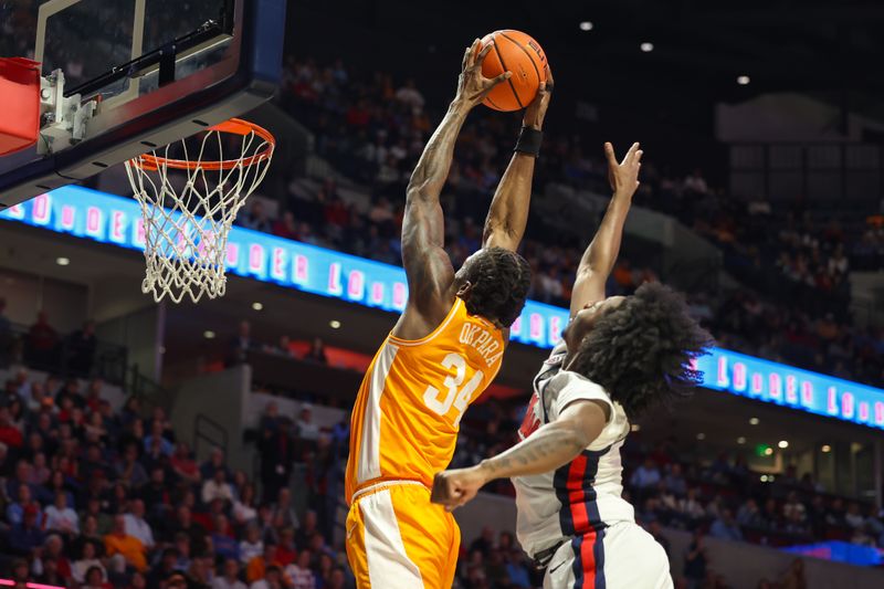 Mar 5, 2025; Oxford, Mississippi, USA; Tennessee Volunteers forward Felix Okra (34) dunks the ball against the Mississippi Rebels during the first half at The Sandy and John Black Pavilion at Ole Miss. Mandatory Credit: Wesley Hale-Imagn Images