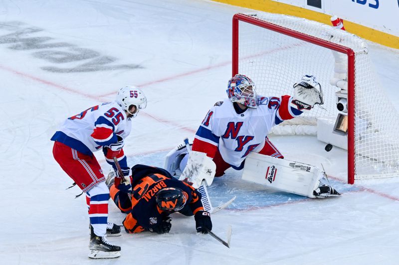 Feb 18, 2024; East Rutherford, New Jersey, USA;  New York Islanders center Mathew Barzal (13) scores a goal past New York Rangers goaltender Igor Shesterkin (31)  defended by New York Rangers defenseman Ryan Lindgren (55) during the first period in a Stadium Series ice hockey game at MetLife Stadium. Mandatory Credit: Dennis Schneidler-USA TODAY Sports