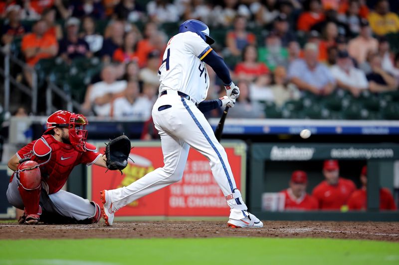 Sep 1, 2025; Houston, Texas, USA; Houston Astros left fielder Yordan Alvarez (44) hits an RBI single against the Los Angeles Angels during the eighth inning at Daikin Park. Mandatory Credit: Erik Williams-Imagn Images