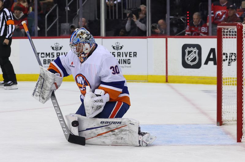 Oct 25, 2024; Newark, New Jersey, USA; New York Islanders goaltender Ilya Sorokin (30) makes a save against the New Jersey Devils during the second period at Prudential Center. Mandatory Credit: Ed Mulholland-Imagn Images