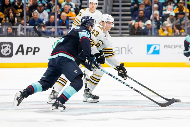 Feb 26, 2024; Seattle, Washington, USA; Boston Bruins left wing Danton Heinen (43) skates with the puck against the Seattle Kraken during the second period at Climate Pledge Arena. Mandatory Credit: Joe Nicholson-USA TODAY Sports