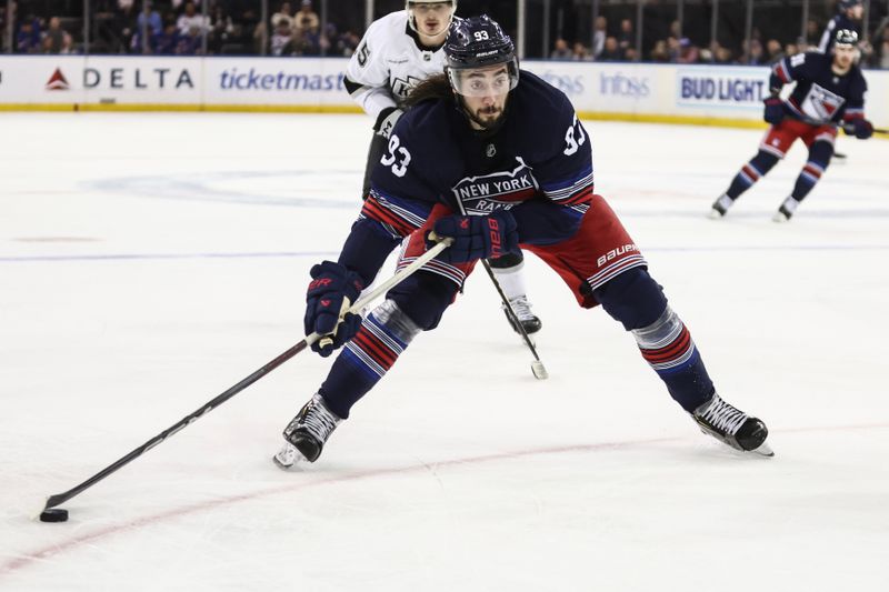 Dec 14, 2024; New York, New York, USA;  New York Rangers center Mika Zibanejad (93) controls the puck in the second period against the Los Angeles Kings at Madison Square Garden. Mandatory Credit: Wendell Cruz-Imagn Images