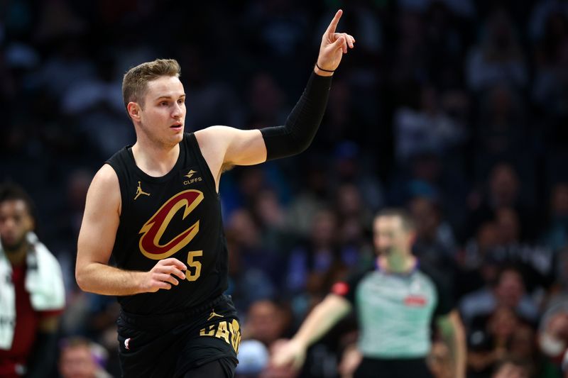 CHARLOTTE, NORTH CAROLINA - MARCH 27: Sam Merrill #5 of the Cleveland Cavaliers reacts following a basket during the first half of the game against the Charlotte Hornets at Spectrum Center on March 27, 2024 in Charlotte, North Carolina. NOTE TO USER: User expressly acknowledges and agrees that, by downloading and or using this photograph, User is consenting to the terms and conditions of the Getty Images License Agreement. (Photo by Jared C. Tilton/Getty Images)