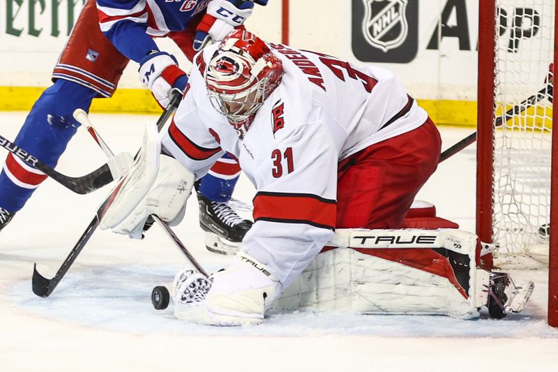 May 5, 2024; New York, New York, USA; Carolina Hurricanes goaltender Frederik Andersen (31) makes a save on a shot on goal attempt in the second period against the New York Rangers in game one of the second round of the 2024 Stanley Cup Playoffs at Madison Square Garden. Mandatory Credit: Wendell Cruz-USA TODAY Sports