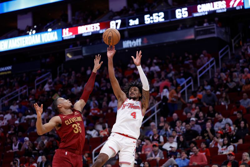 HOUSTON, TEXAS - MARCH 16: Jalen Green #4 of the Houston Rockets shoots a basket over Isaac Okoro #35 of the Cleveland Cavaliers during the second half at Toyota Center on March 16, 2024 in Houston, Texas. NOTE TO USER: User expressly acknowledges and agrees that, by downloading and or using this photograph, User is consenting to the terms and conditions of the Getty Images License Agreement. (Photo by Carmen Mandato/Getty Images)