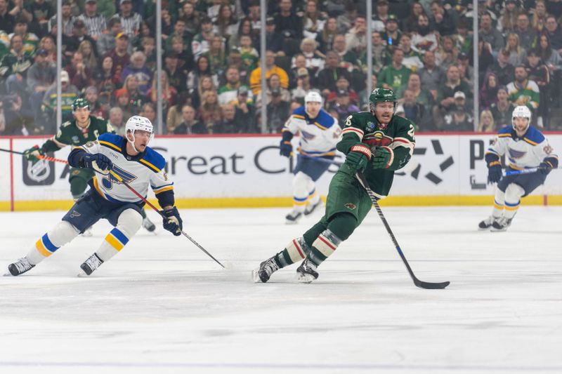 Apr 8, 2023; Saint Paul, Minnesota, USA; Minnesota Wild center Gustav Nyquist (28) chases a puck, trailed by St. Louis Blues left wing Jakub Vrana (15) in the first period at Xcel Energy Center. Mandatory Credit: Matt Blewett-USA TODAY Sports