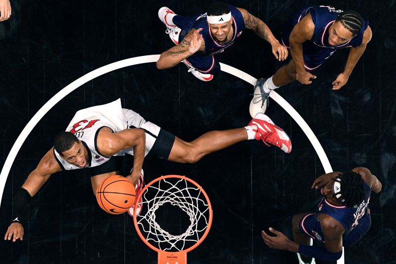 Jan 3, 2024; San Diego, California, USA; San Diego State Aztecs forward Jaedon LeDee (13) lays the ball up during the first half against the Fresno State Bulldogs at Viejas Arena. Mandatory Credit: Orlando Ramirez-USA TODAY Sports 