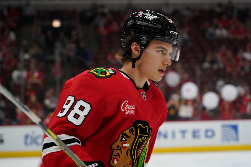 Oct 4, 2024; Chicago, Illinois, USA; Chicago Blackhawks center Connor Bedard (98) during warmups before a game against the Minnesota Wild at United Center. Mandatory Credit: David Banks-Imagn Images