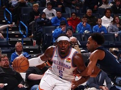 OKLAHOMA CITY, OK - DECEMBER 18:  Luguentz Dort #5 of the Oklahoma City Thunder handles the ball during the game against the Memphis Grizzlies on December 18, 2023 at Paycom Arena in Oklahoma City, Oklahoma. NOTE TO USER: User expressly acknowledges and agrees that, by downloading and or using this photograph, User is consenting to the terms and conditions of the Getty Images License Agreement. Mandatory Copyright Notice: Copyright 2023 NBAE (Photo by Zach Beeker/NBAE via Getty Images)