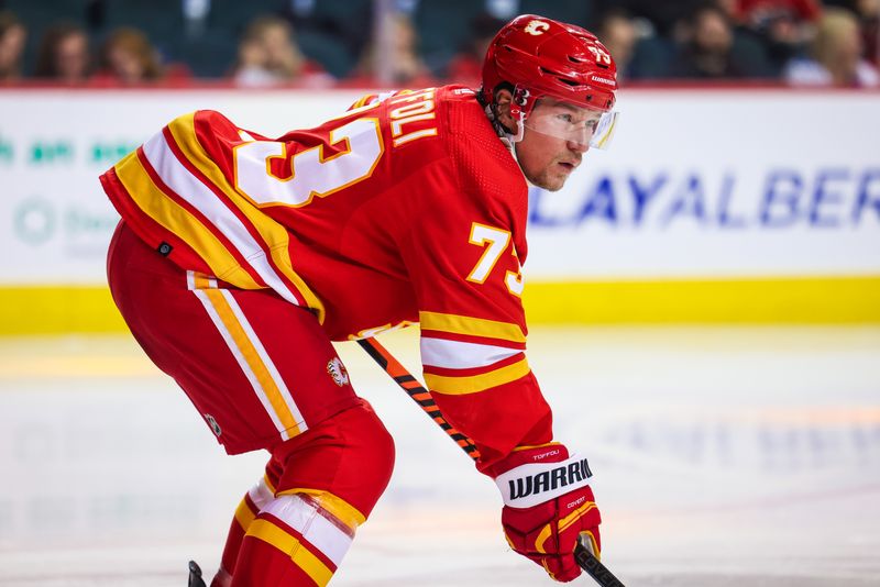 Mar 28, 2023; Calgary, Alberta, CAN; Calgary Flames right wing Tyler Toffoli (73) during the face off against the Los Angeles Kings during the third period at Scotiabank Saddledome. Mandatory Credit: Sergei Belski-USA TODAY Sports