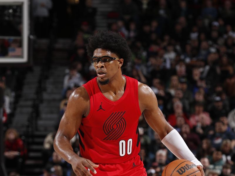 PORTLAND, OR - MARCH 23: Scoot Henderson #00 of the Portland Trail Blazers dribbles the ball during the game against the Denver Nuggets on March 23, 2024 at the Moda Center Arena in Portland, Oregon. NOTE TO USER: User expressly acknowledges and agrees that, by downloading and or using this photograph, user is consenting to the terms and conditions of the Getty Images License Agreement. Mandatory Copyright Notice: Copyright 2024 NBAE (Photo by Cameron Browne/NBAE via Getty Images)